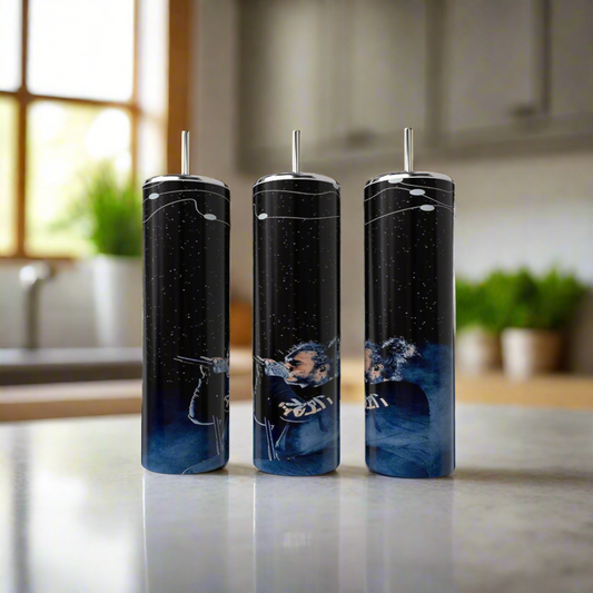 Three luxury-inspired Kreative Kreationz Post Malone Blue tumblers, crafted from high-quality stainless steel with a cosmic design in white and blue, stand on a kitchen counter beside a plant and window, creating a bright and modern setting.