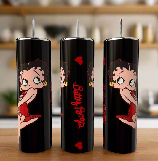 Three white 20oz skinny tumblers by Kreative Kreationz, featuring cartoon character Betty Boop in a red dress with red hearts and "Betty Boop" text, displayed on a wooden surface with a blurred kitchen background.
