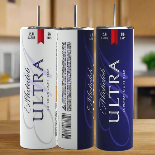 Three Michelob ULTRA light beer cans sit on a kitchen counter, showing front, side, and back views. Pair your beer with the Kreative Kreationz Michelob Ultra 20oz Stainless Steel Tumbler for the perfect sip.