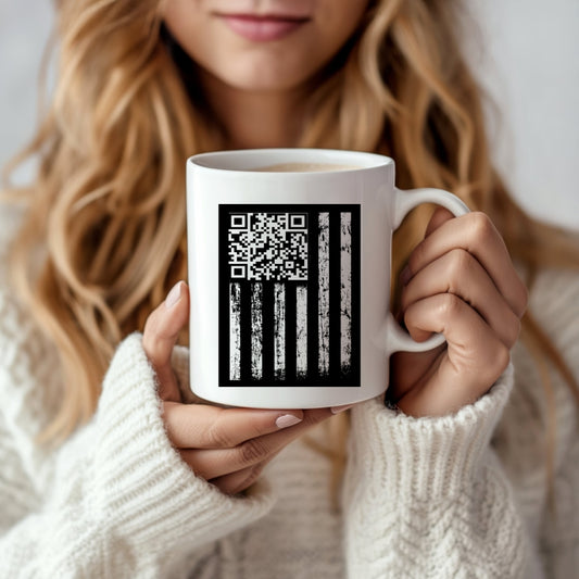 A woman with long blonde hair in a white knit sweater holds the Trump Dancing QR Code Mug by Kreative Kreationz, featuring a black American flag design with a QR code replacing the stars.