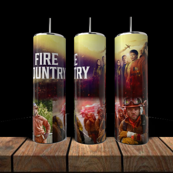 Three Fire Country 20oz Skinny Tumblers by Kreative Kreationz with straws, eco-friendly stainless steel, bold firefighter and flame graphics, and "FIRE COUNTRY" text displayed on wood against a black backdrop.