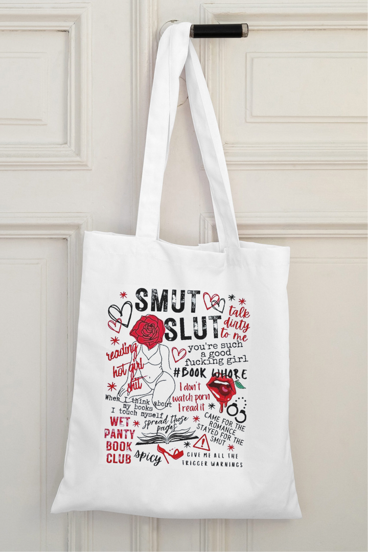 The Smut Canvas Reusable Bag by Kreative Kreationz features red and black bookish romance phrases, doodles of hearts, stars, and roses. Eco-friendly and spacious—perfect as an everyday tote for "SMUT SLUT" and "Panty Book Club" fans.