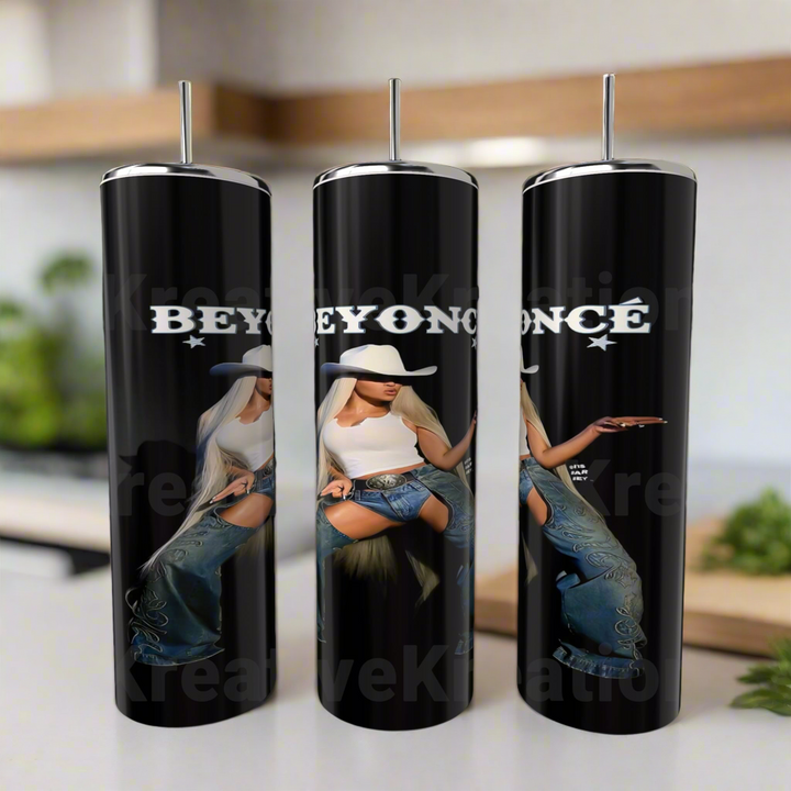 The Beyonce 20oz Stainless Steel Tumblers by Kreative Kreationz feature Beyoncé in a white hat, top, and jeans with “BEYONCÉ” above her. These eco-friendly tumblers come with silver straws and add style to any kitchen counter.