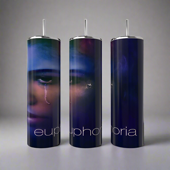 Three tall, slender Kreative Kreationz Euphoria Tumblers with silver lids and straws. Each stainless steel tumbler showcases a dark portrait on a deep blue-purple gradient, with "euphoria" in white at the bottom.