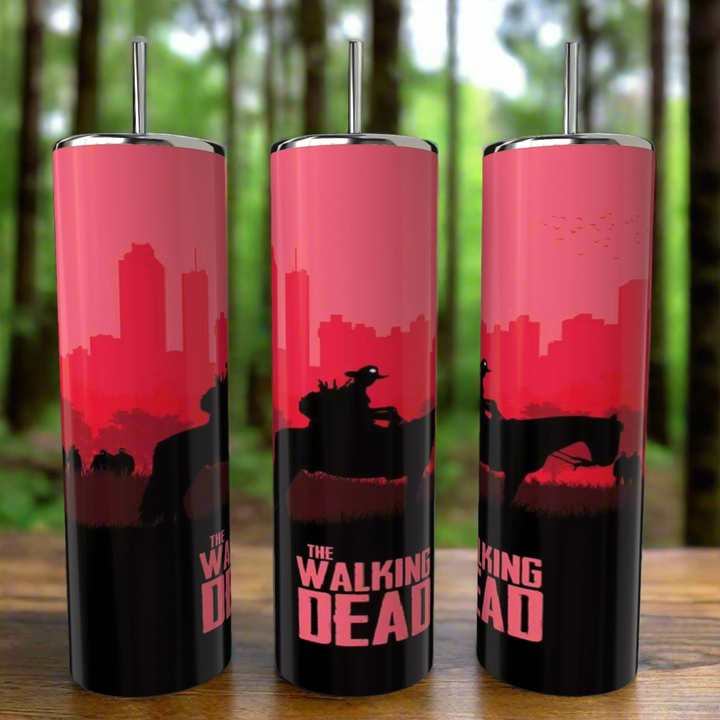 Kreative Kreationz offers three 20oz eco-friendly reusable travel mugs named "The Walking Dead 20oz Skinny Tumbler," featuring a bold red and black design with city silhouettes and zombies against a blurred forest backdrop, making them perfect for any fan's collection.