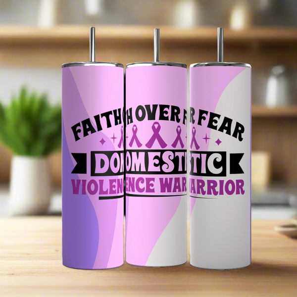 Three Kreative Kreationz Domestic Violence Awareness Tumblers, featuring pink and purple designs with "Faith Over Fear Domestic Violence Warrior" and purple ribbons, are displayed on a kitchen counter with a blurred background.