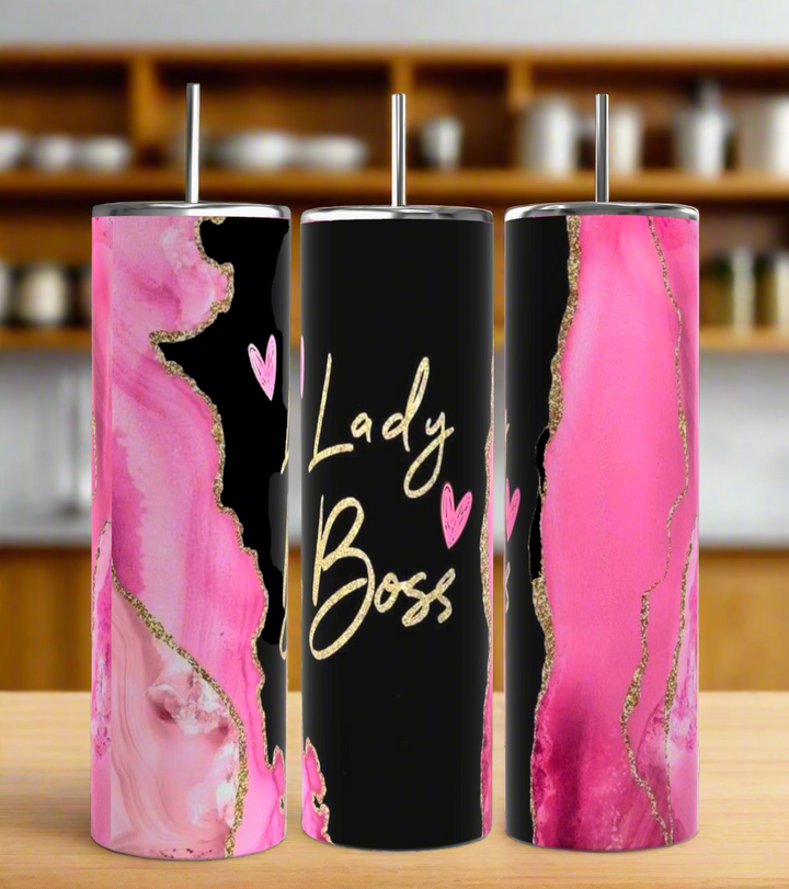 The Kreative Kreationz Boss Lady 20oz Tumbler set includes three tall tumblers with spill-proof lids and reusable straws, featuring pink, black, and gold abstract designs. The center tumbler displays "Lady Boss" in gold script with two pink hearts.