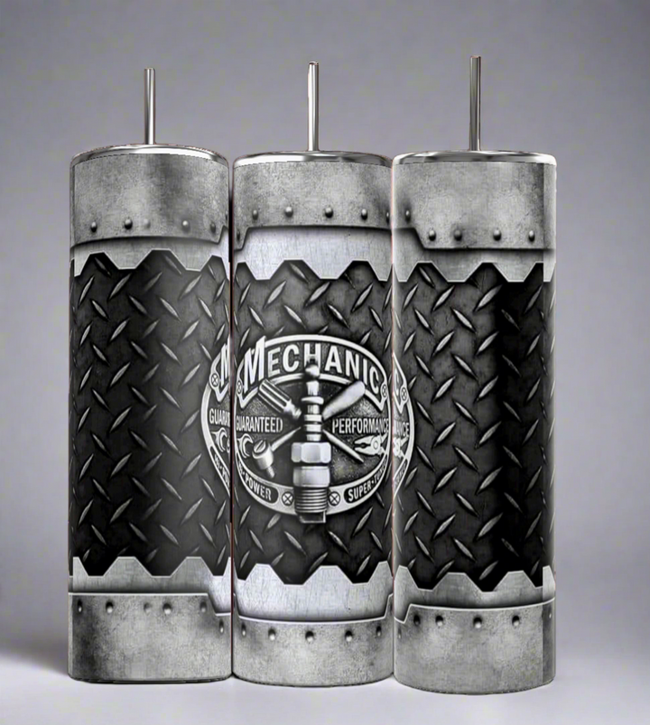 The Kreative Kreationz Mechanic 20oz Tumbler features rugged diamond plate design, riveted edges, and a “Mechanic” logo with spark plug—durable, stainless steel drinkware for those who love functional style.