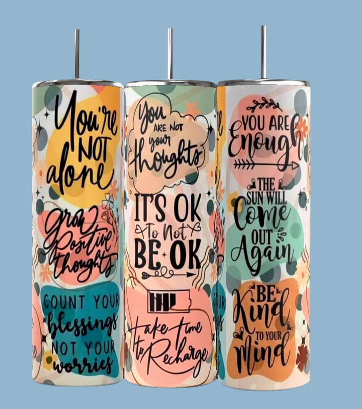 Discover the "It’s Ok Not To Be Ok Affirmations 20oz Skinny Tumbler" by Kreative Kreationz—a trio of stainless steel tumblers. Featuring quotes: "You're not alone," "You’re not your thoughts," and "You are enough," these eco-friendly treasures inspire with colorful floral designs.
