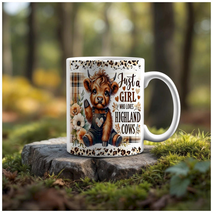 The Kreative Kreationz "Just a Girl Who Loves Highland Cows" ceramic mug features a glossy finish, cute cartoon cow and flowers, plaid accents, and is dishwasher safe—perfect for any Highland cow lover.