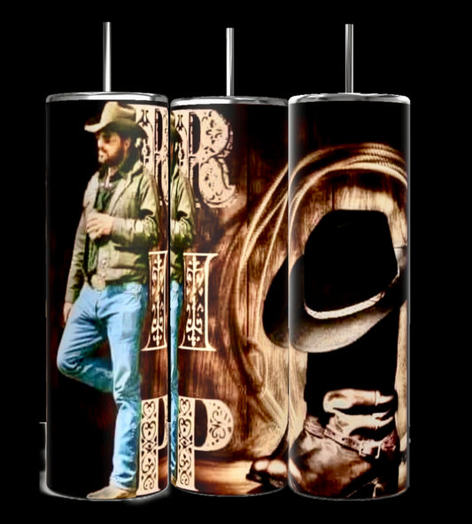 Kreative Kreationz's Yellowstone RIP 20oz Tumblers feature cowboy-themed designs: a man in cowboy attire on the left, intricate lettering in the middle, and a cowboy hat with rope on a wooden backdrop to the right. Ideal for eco-conscious fans of Western aesthetics.