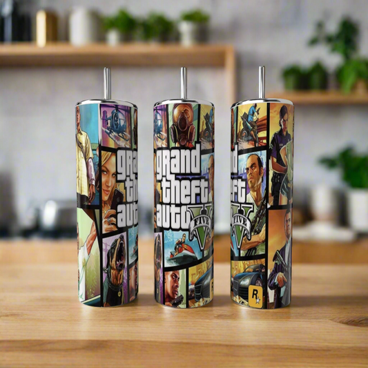 Three eco-friendly Kreative Kreationz Grabd Theft Auto 20oz Tumblers sit on a wooden surface, each featuring vibrant GTA artwork and logo, with a blurred kitchen backdrop highlighting their stylish design.