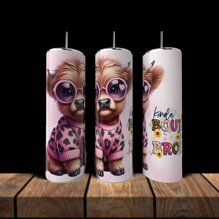 The Kinda Boujee But Broke Cow Collection by Kreative Kreationz features three tall reusable 20oz tumblers with a cute cow in pink sunglasses and a leopard print jacket. One tumbler reads "kinda boujee kinda broke" in colorful, playful text with flowers.
