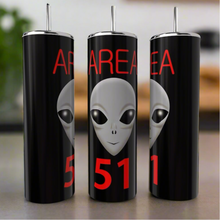 Three black Kreative Kreationz Area 51 20oz Skinny Tumblers with metal straws are displayed, each featuring a large gray alien face and bold red "AREA 51" text, standing out as eco-friendly drinkware.