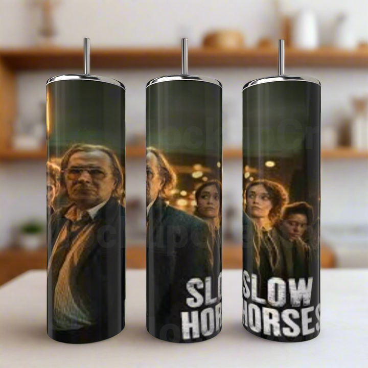 The Kreative Kreationz Slow Horses 20oz Stainless Steel Tumbler features eco-friendly construction and printed TV series characters, including a man in glasses and suit, with the bold show title—perfect for Slow Horses fans.