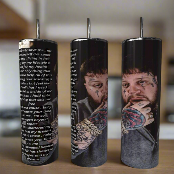 Kreative Kreationz's Jelly Roll “Save Me” Lyrics 20oz Tumblers feature a tattooed man in a gray shirt on one side and the song’s lyrics on the other—stylish, eco-friendly, reusable stainless steel drinkware.