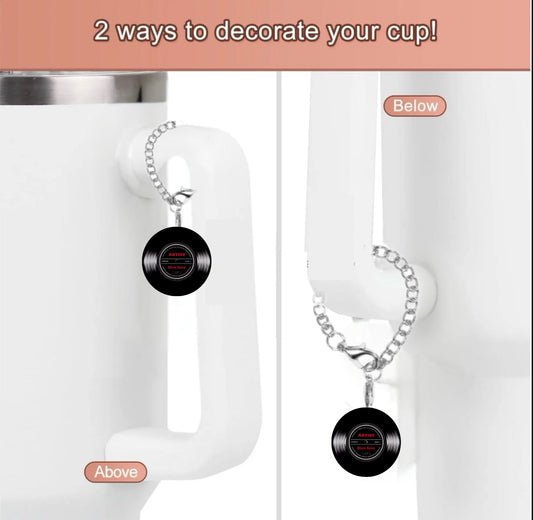 The Kreative Kreationz Personalized Vinyl Charm Dangle lets you decorate your mug handle two ways—charm hangs above or below. Fun vinyl record design makes your cup unique! Text: "2 ways to decorate your cup!.