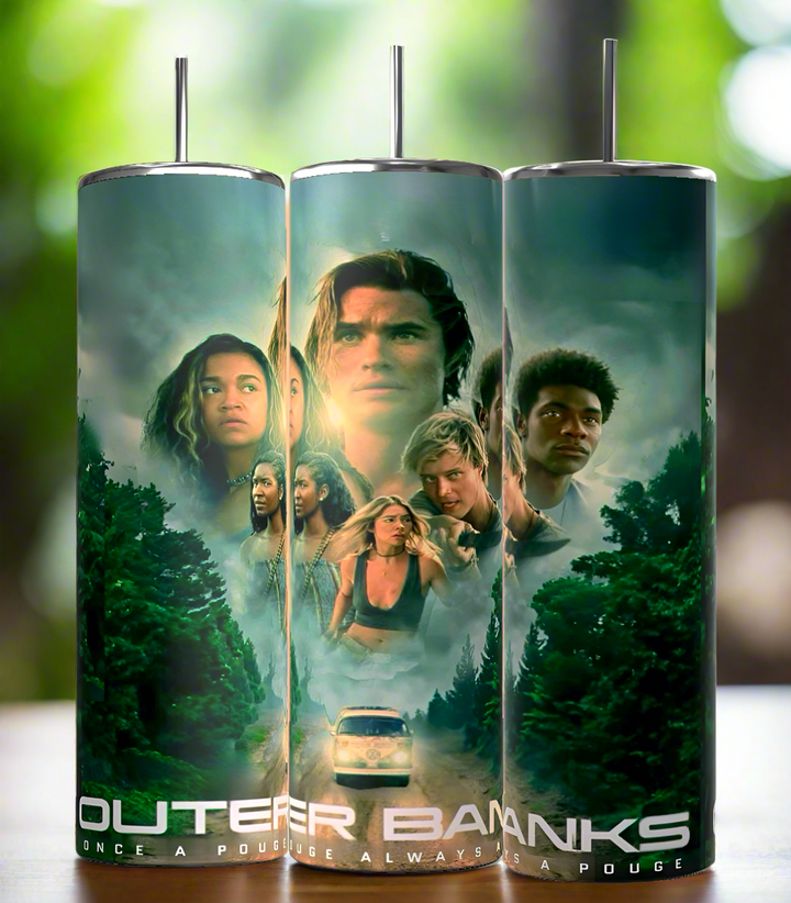 The Kreative Kreationz Outer Banks 20oz Tumbler features series characters with a forest, car, and dramatic skies, plus the quote “Outer Banks. Once a Pogue, Always a Pogue.” Includes spill-proof lid for easy sipping.