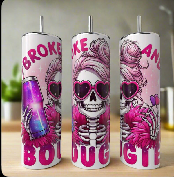 The Kinda Boujee But Broke 20oz Tumbler by Kreative Kreationz features a cartoon skeleton with pink sunglasses and a fur coat holding a sparkly cup, plus bold "Broke and Bougie" text on a glittery pink background—perfect for Halloween!.