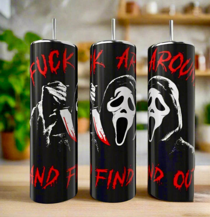 Kreative Kreationz's Ghostface FAFO 20oz Tumblers feature the iconic Scream mask, a bloody knife, and bold red "FUCK AROUND AND FIND OUT" text, shown on a kitchen counter with blurred plants in the background.