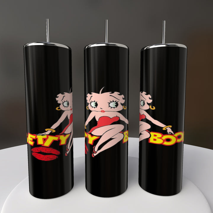 Three stylish Betty B20oz Skinny Tumblers by Kreative Kreationz feature a retro cartoon design with a woman in a red dress and bold "Betty Boop" letters on a gray background, elegantly displayed on white.